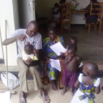 CHW at health facility with mother coming for Immunization