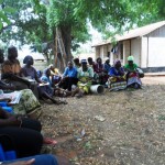 CHWs in a monthly meeting